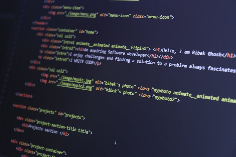 A close-up view of a computer screen displaying lines of colorful HTML and CSS code, with syntax highlighting in hues of blue, green, yellow, and red. The code appears to be part of a web development